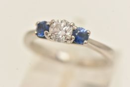 A PLATINUM THREE-STONE RING, a round brilliant cut diamond, GIA certified diamond, certified carat