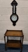 AN EARLY 20TH CENTURY OAK TWO-TIER TROLLEY, along with a barometer Dimensions:trolley width 63cm x