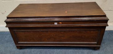 A 20TH CENTURY OAK BLANKET CHEST, with a hinged lid, raised on castors Dimensions:width 124cm x