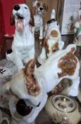 FOUR ROYAL DOULTON CHARACTER DOGS, comprising HN1099 (extensive cracks), HN1103 (restored),