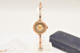 AN EARLY 20TH CENTURY 9CT GOLD WRISTWATCH, manual wind, round silver and gold tone dial, Arabic