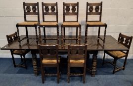 A 20TH CENTURY OAK DRAW LEAF DINING TABLE, raised on block and turned legs, united by stretchers,