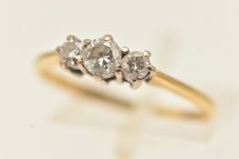 A YELLOW METAL DIAMOND THREE STONE RING, three round brilliant cut diamonds, each in a claw setting,