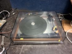A THORENS TD160 TURNTABLE with a teak plinth and a smoked plexiglass cover (hinges damaged) (PAT