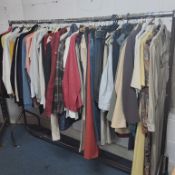 ONE RAIL OF WOMANS CLOTHING, approximately seventy-five items to include trousers, jeans, jackets,