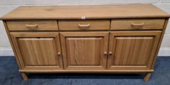 A MODERN PINE SIDEBOARD, fitted with three drawers over triple cupboard doors Dimensions:width 163cm