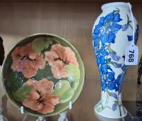 TWO PIECES OF MOORCROFT POTTERY, comprising a Delphinium pattern baluster vase, height 21cm (large