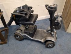 A STERLING SAPPHIRE MOBILITY SCOOTER (SPARES OR REPAIRS) no key but has charger (untested) and