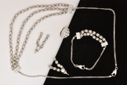 A WHITE METAL JEWELLERY SUITE, to include a necklace, a bracelet, a pair of earrings and a ring, set