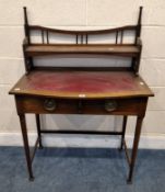 AN ART NOUVEAU MAHOGANY LADIES WRITING DESK, the raised back with a single shelf, atop a base with a