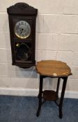 AN EARLY 20TH CENTURY OAK TWO-TIER OCCASIONAL TABLE, along with a wall clock Dimensions:table