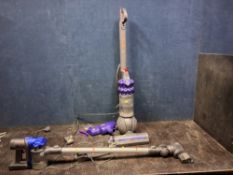 A DYSON DC35 CORDLESS VACUUM CLEANER with wall bracket and charger (brushbar not turning), along
