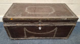 AN EARLY 20TH CENTURY LEATHER BOUND TRUNK, with studded details, signed Captain Christie