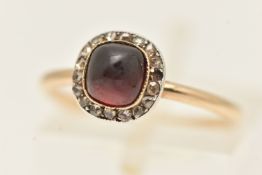 A YELLOW METAL GARNET AND DIAMOND CLUSTER RING, of a circular form set with a central sugar loaf