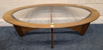 A MID CENTURY G PLAN ASTRO OVAL COFFEE TABLE, with a glass insert Dimensions:width 123cm x depth