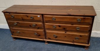 A MODERN PINE SIDEBOARD, fitted with two banks of three graduated drawers Dimensions:width 166cm x