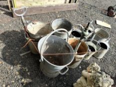 TWELVE VINTAGE GALVANISED ITEMS, including eight buckets, two with stirrup pumps attached, a large