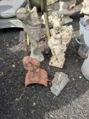 TWO CONCRETE GARDEN FIGURES, including a small child holding a large shell, 67cm high, a small child