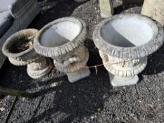 THREE CONCRETE GARDEN URNS, including a pair of one-piece campagna urns, 52cm high, and a two-