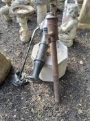 TWO CAST IRON VINTAGE WATER PUMPS AND A CONCRETE OCTAGONAL BASE, for the larger pump to be mounted