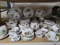 A ROYAL WORCESTER 'EVESHAM' PATTERN AND SIMILAR DINNER SERVICE comprising a large oval platter,