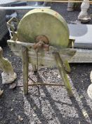 A TREADLE SHARPENING STONE, on a wooden-framed stand Dimensions:91cm high