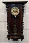 A 20TH CENTURY VIENNA WALL CLOCK, the arched glass door enclosing an 8-inch enamel dial, depicting