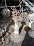 A MODERN CONCRETE SUNDIAL, with a cast iron armillary style dial and a brass sundial, both are not