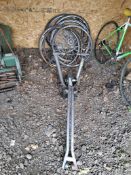 A CYCLE OPS BIKE TRAINER, A VEHICLE BIKE CARRIER AND BIKE WHEELS, including 5 wheels (one with a
