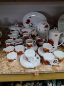 A SUSIE COOPER FOR WEDGWOOD 'CORNPOPPY' PART DINNER SERVICE comprising an oval serving platter,
