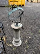 A MODERN ARMILLARY SUNDIAL ON A CONCRETE CORINTHIAN COLUMN BASE. The dial appears to be