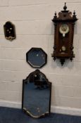 A 20TH CENTURY WALL CLOCK, with triple finials, lion mask details, the arched glass door enclosing a