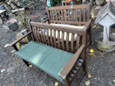 TWO HARDWOOD GARDEN BENCHES with seat cushions, 121 and 127cm wide Condition Report:weathering and
