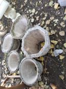 FIVE CONCRETE GARDEN PLANTERS, including a pair with brickwork effect panels, 32cm high, and three