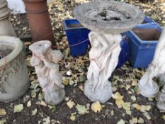 A CONCRETE BIRDBATH with central support depicting three maidens around a column 80cm high and a
