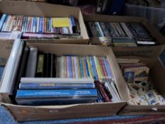 FOUR BOXES OF DVDS, CDS AND TRADE CARDS, comprising a quantity of DVDs and DVD box sets, including