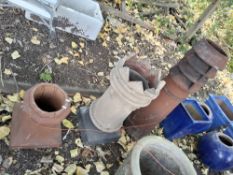 THREE VICTORIAN CHIMNEY POTS, the largest being 105cm high Condition Report:chips and losses to