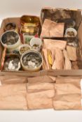 A cardboard box containing a large quantity of pennies in tins and bags, around 250 coins from Queen