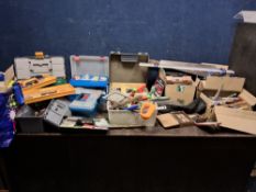 A CAST IRON SINGER SEWING MACHINE BASE CONVERTED INTO A WORKBENCH AND A QUANTITY OF TOOLS, including
