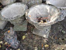 A PAIR OF CONCRETE GARDEN URNS with lattice detail to bowls, both 45cm high Condition Report:crack