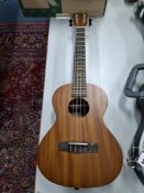 A MAKALA BY KALA MK-TE ELECTRO-ACOUSTIC TENOR UKULELE with natural satin finished body, dark