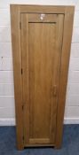 A MODERN LIGHT OAK SINGLE DOOR CABINET, enclosing shelves Dimensions:width 66cm x depth 57cm x