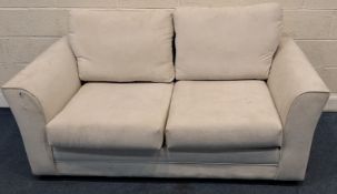 A BEIGE UPHOLSTERED TWO SEATER SOFA BED Dimensions:width 173cm x depth 91cm x height 99cm