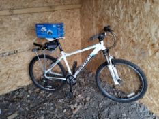 A CARRERA VALOUR GENTS MOUNTAIN BIKE, a 19in frame, 21-speed Shimano gears and a helmet