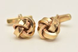 A PAIR OF YELLOW METAL CUFFLINKS, each designed as a knot with toggle fittings, stamped 333,