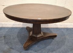 A LARGE CIRCULAR TILT TOP BREAKFAST TABLE, raised on a hexagonal pillar and a triform base with