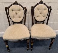 A PAIR OF CHAIRS, with scrolled details, beige upholstery, raised on cylindrical tapered front