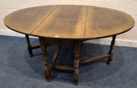 POSSIBLY TITCHMARSH AND GOODWIN, A GOOD QUALITY REPRODUCTION OAK OVAL GATE LEG TABLE, with a