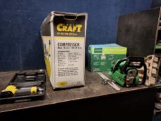 A NEW, SEALED IN BOX POWER CRAFT TA25/180 OIL FREE AIR COMPRESSOR with a Power Craft air nailer