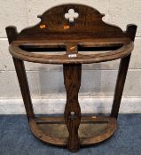 AN EARLY 20TH CENTURY OAK UMBRELLA / STICK STAND, with a three-leaf clover detail, two sections